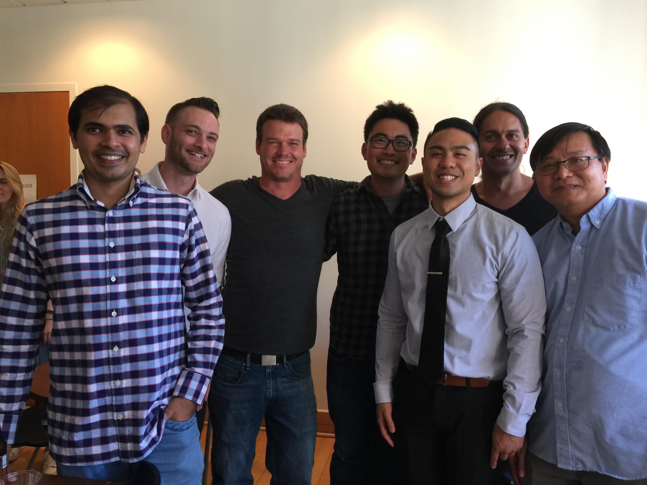 A group of lab members posing after Brian Truong's (third from right) dissertation defense