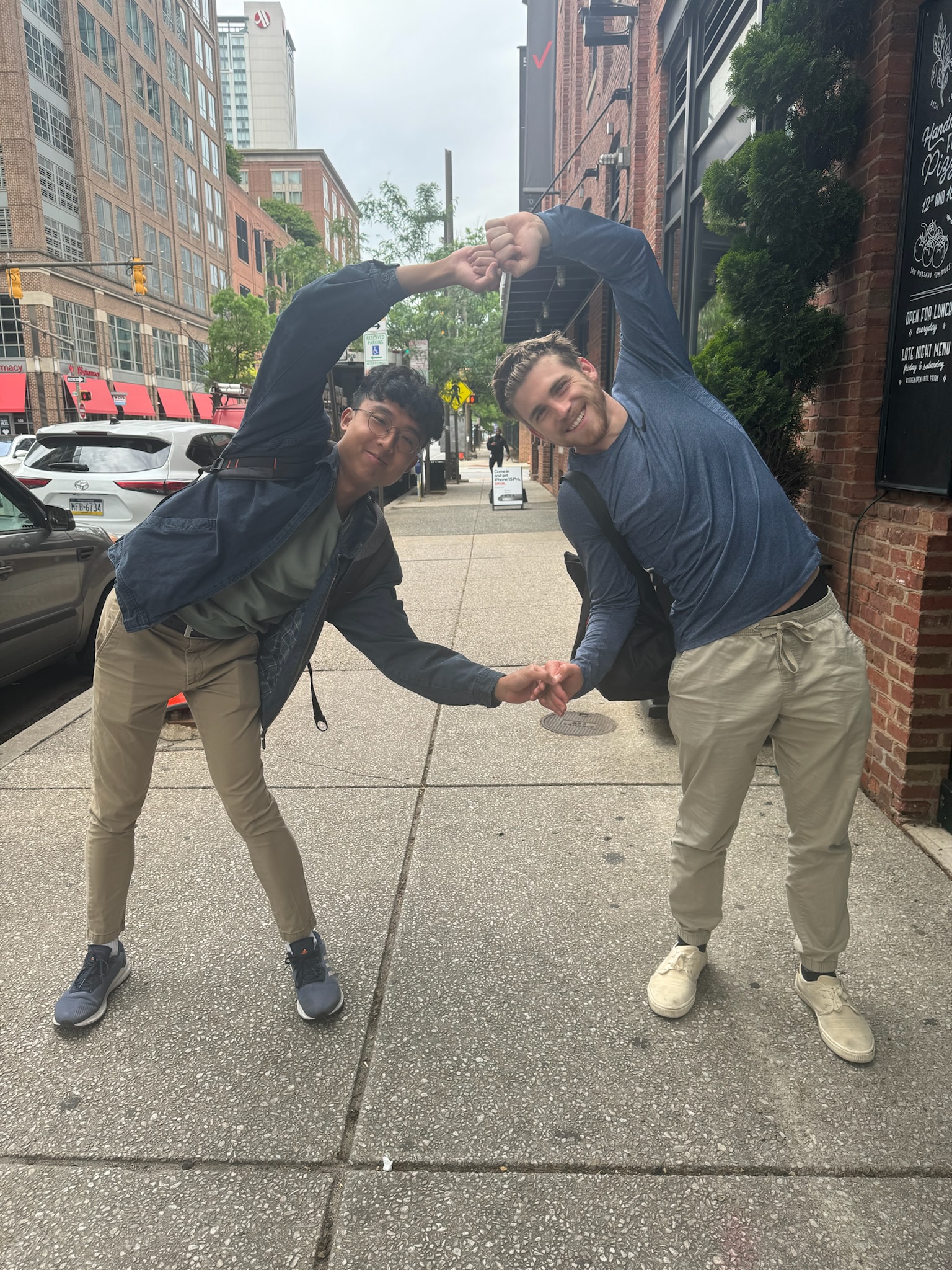 Two students striking a pose on the streets of Baltimore.